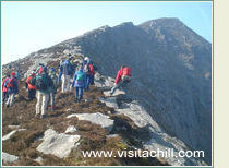 Peering over the cliff edge, Slievemore. Achill Walks Festival 2003